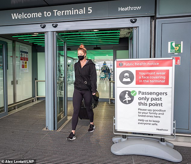 International travel bans can be three times as effective at controlling coronavirus' spread than quarantining incoming travellers, a study suggests (Heathrow Airport last month)