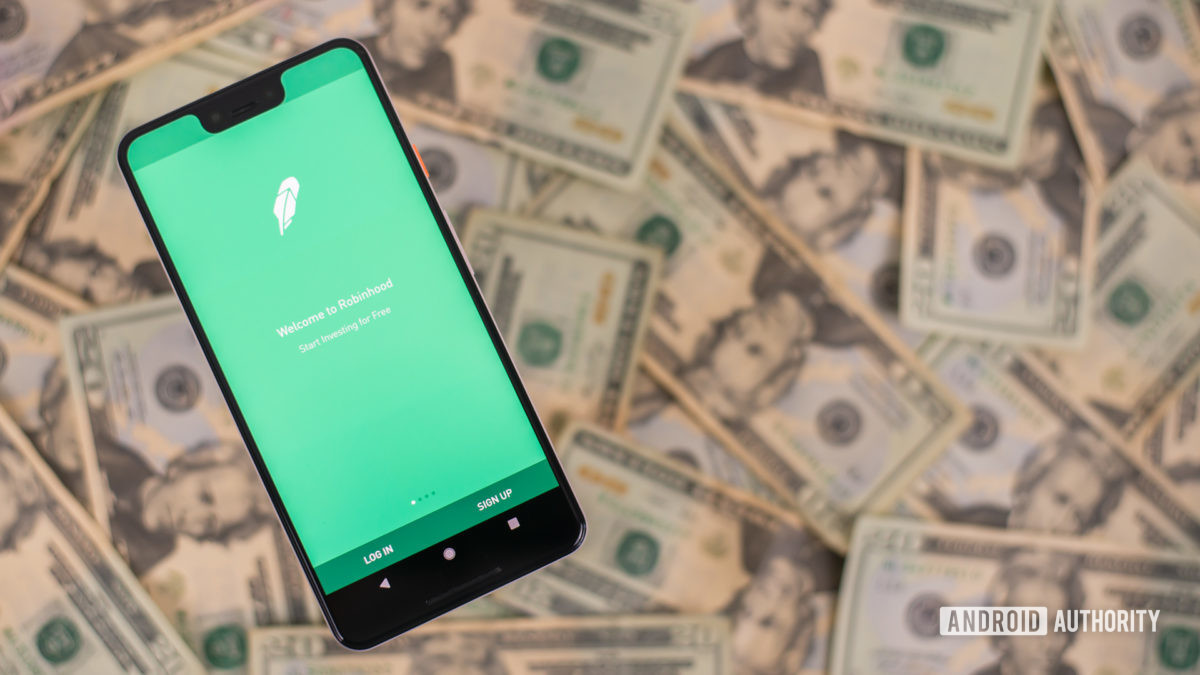 تطبيق Robin Hood على الهاتف الذكي مع المال على خلفية الصورة